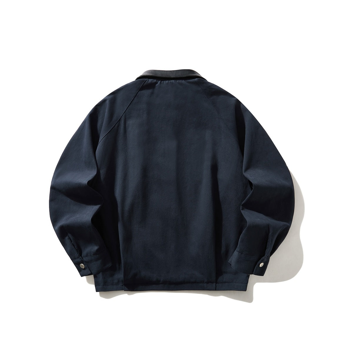 Back view of a dark navy long-sleeved jacket with a black collar and buttoned cuffs.