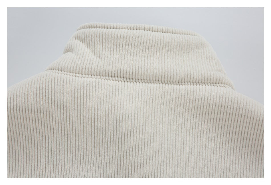 Close-up of the cream corduroy jacket's wide ribbed collar and upper back.