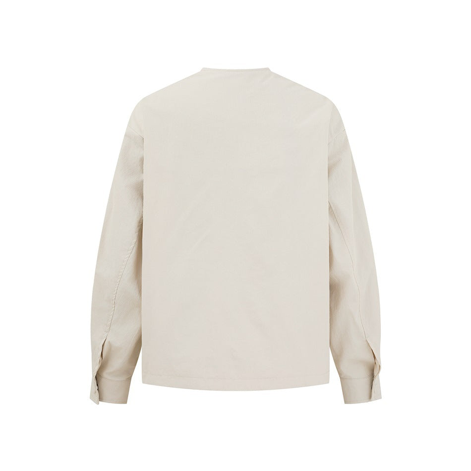 Back view of an ivory long-sleeved shirt jacket with a plain back and buttoned cuffs.