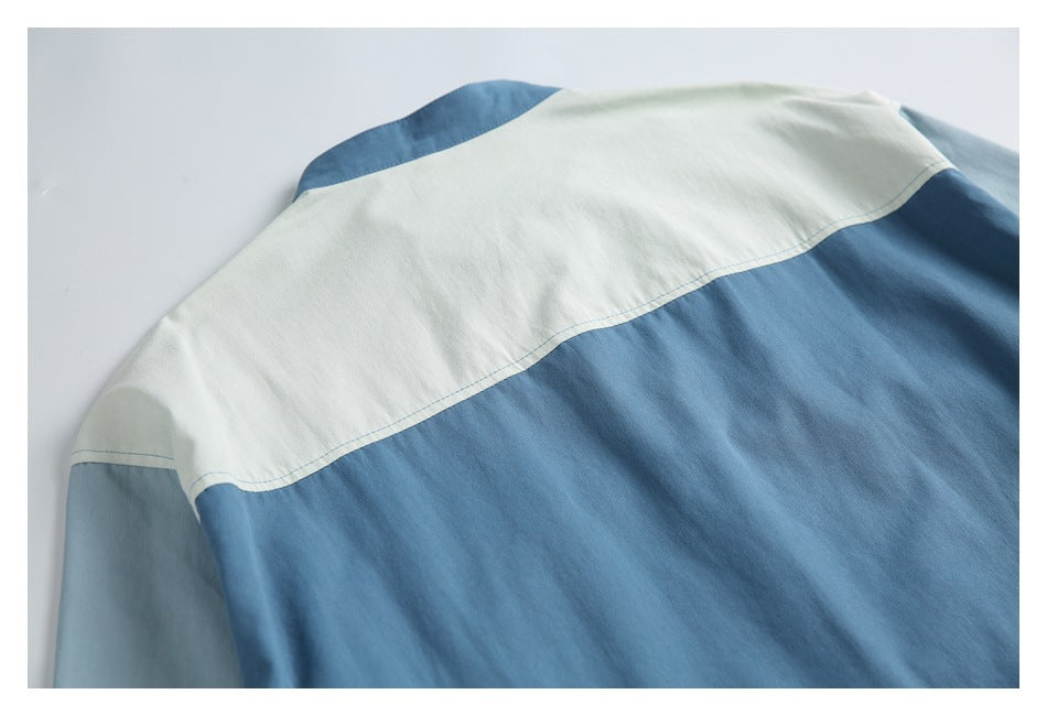 Close-up of the shirt's back with a white shoulder yoke and blue lower panel.