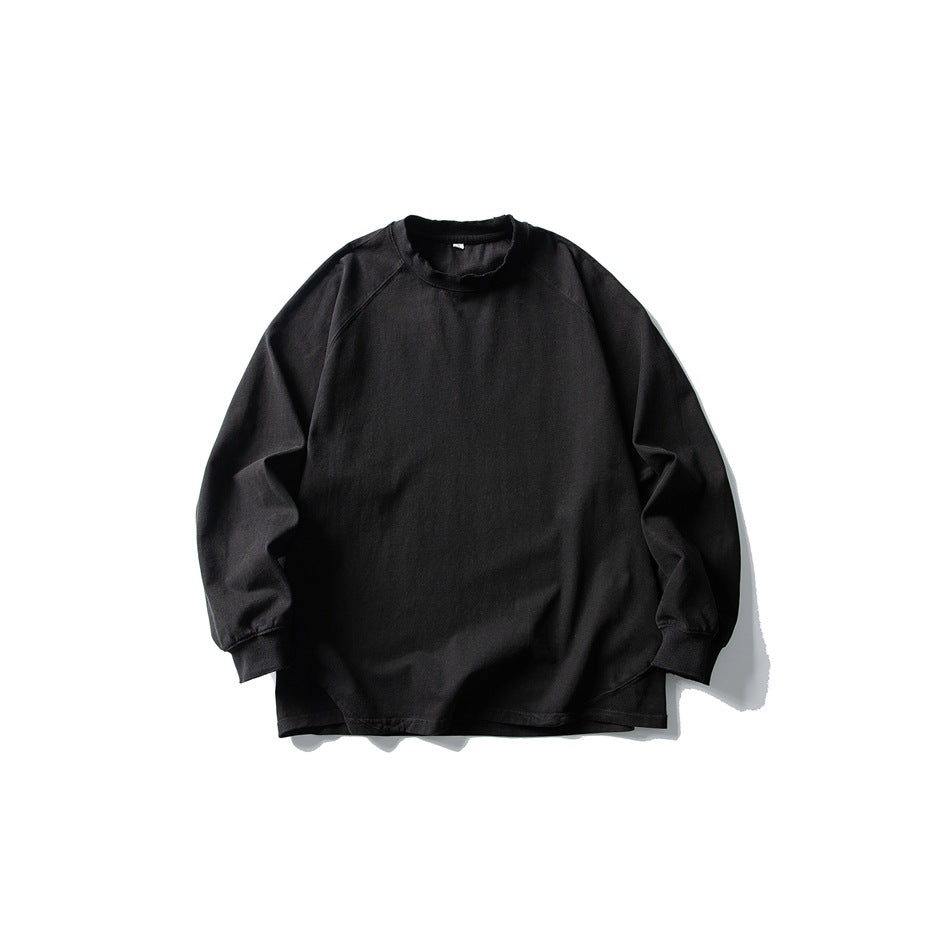 Black long-sleeve raglan crew-neck T-shirt flat lay, front view