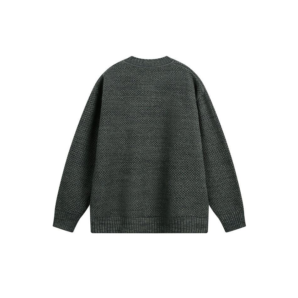 Back view of a charcoal gray textured knit sweater with a ribbed crew neckline, cuffs and hem.