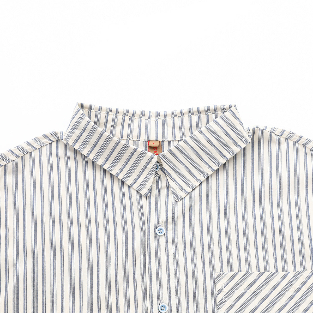Close-up of a blue-gray striped shirt showing its pointed collar, buttons, and chest pocket with angled stripes.
