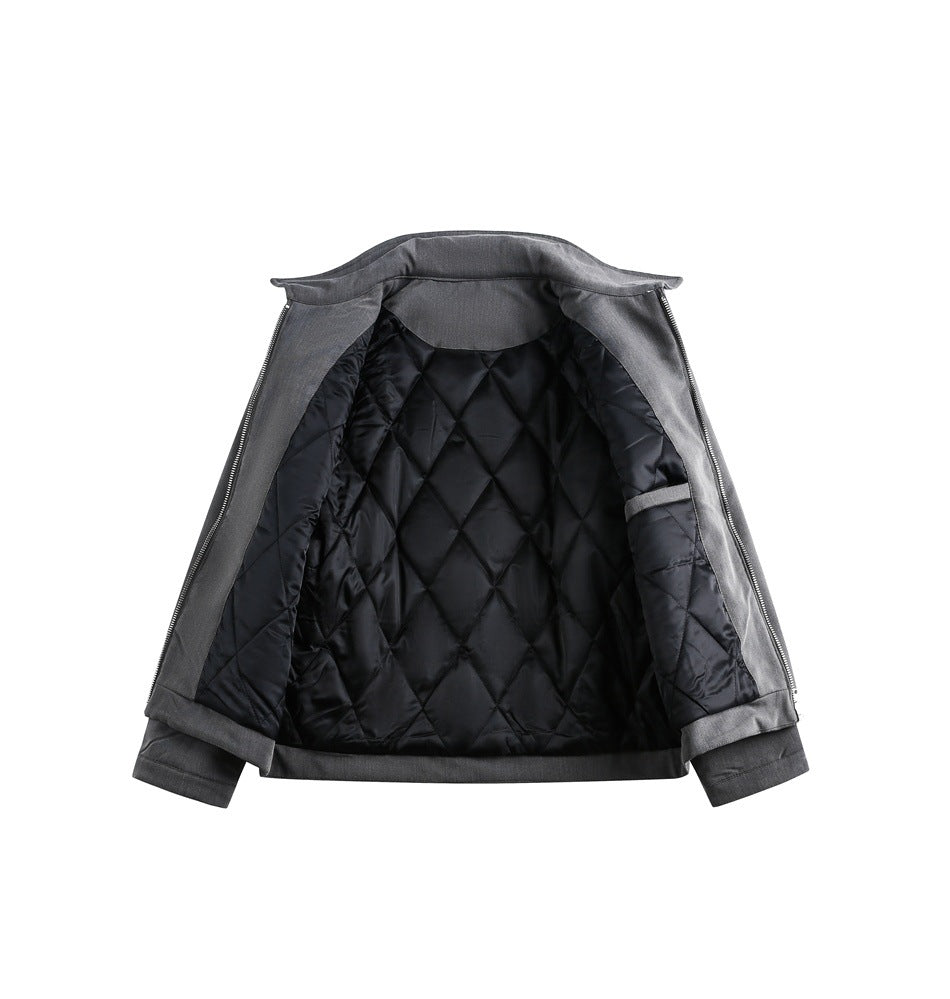 Open charcoal gray jacket showing its black diamond-quilted lining and inside pocket.