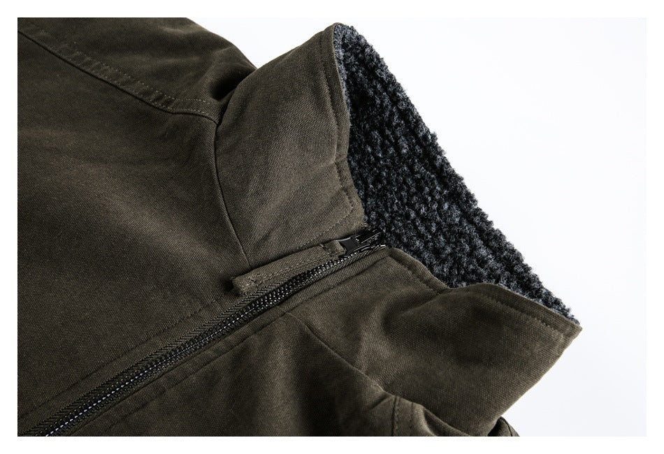 Close-up of an olive-brown jacket collar, black zipper, and dark fleece lining.