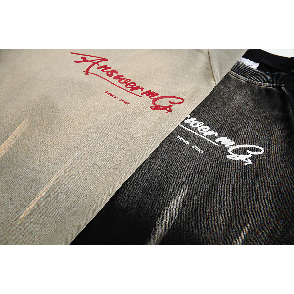 Close-up of khaki and black T-shirt fronts showing contrasting script graphics and faded vertical accents.