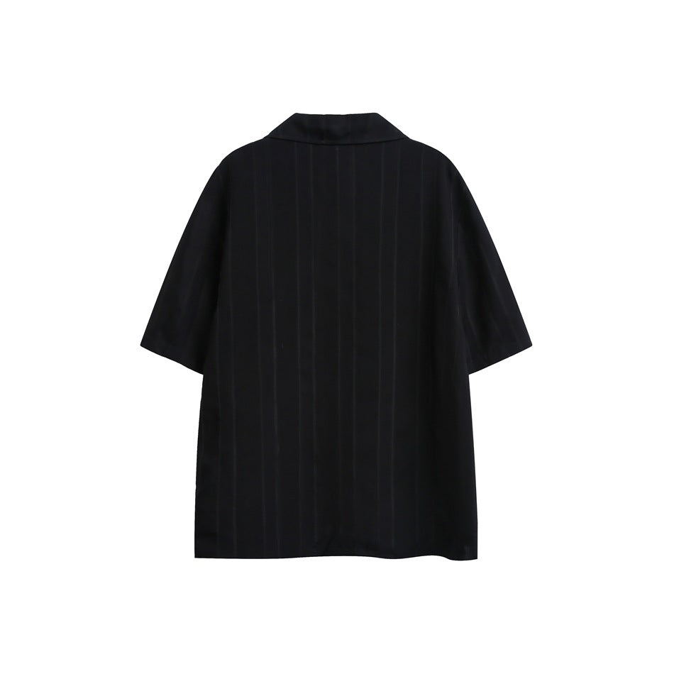 Back view of a black short-sleeve collared shirt with subtle vertical stripes.