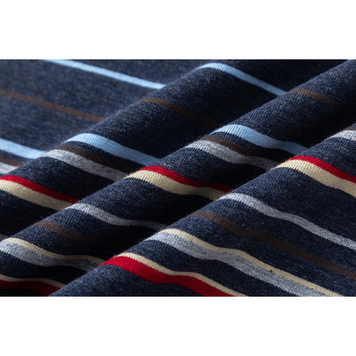 Close-up showing the navy knit fabric and thin red, blue, beige, gray, and brown stripes.