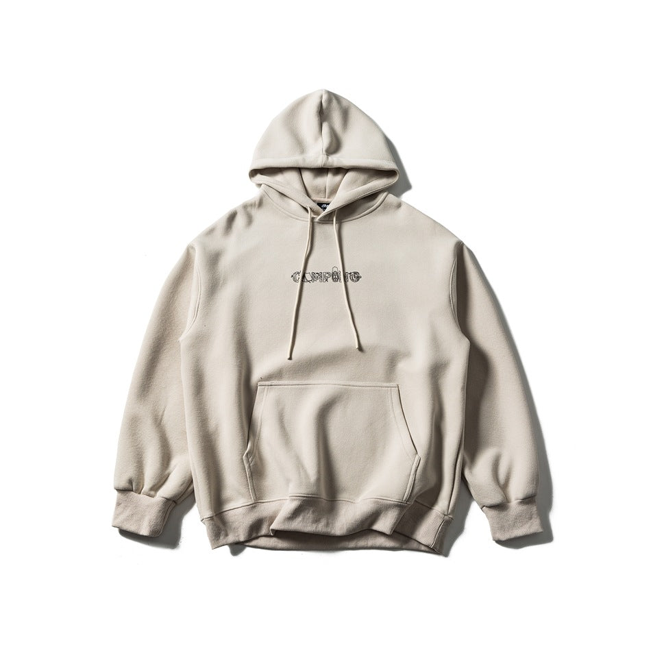 Front of a light apricot hooded sweatshirt with drawstrings, front pocket, ribbed cuffs and a small chest graphic