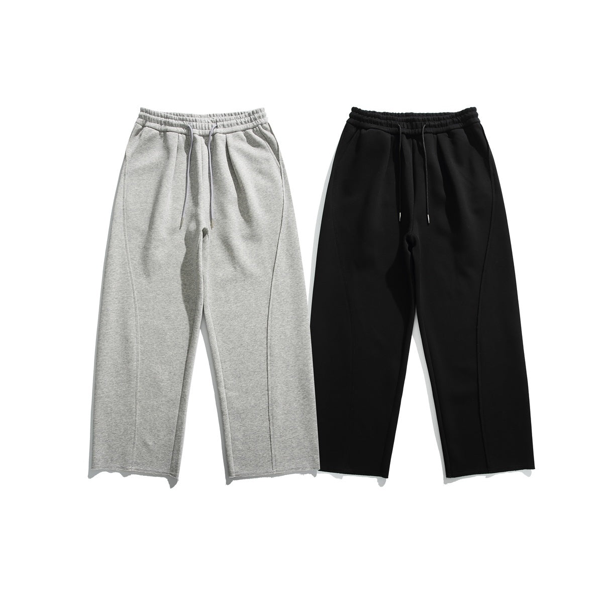 Front view of two pairs of wide-leg sweatpants, one heather gray and one black, with elastic waists and drawstrings.