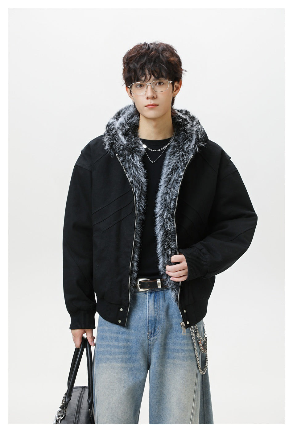 Model wearing an open black jacket with gray faux-fur hood trim, ribbed cuffs, and hem.