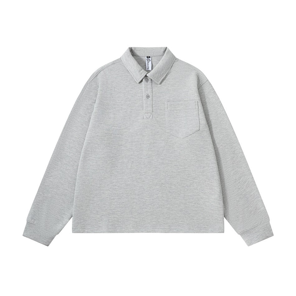 Gray heathered long-sleeve polo-collar top with two-button placket and chest pocket, flat lay front view