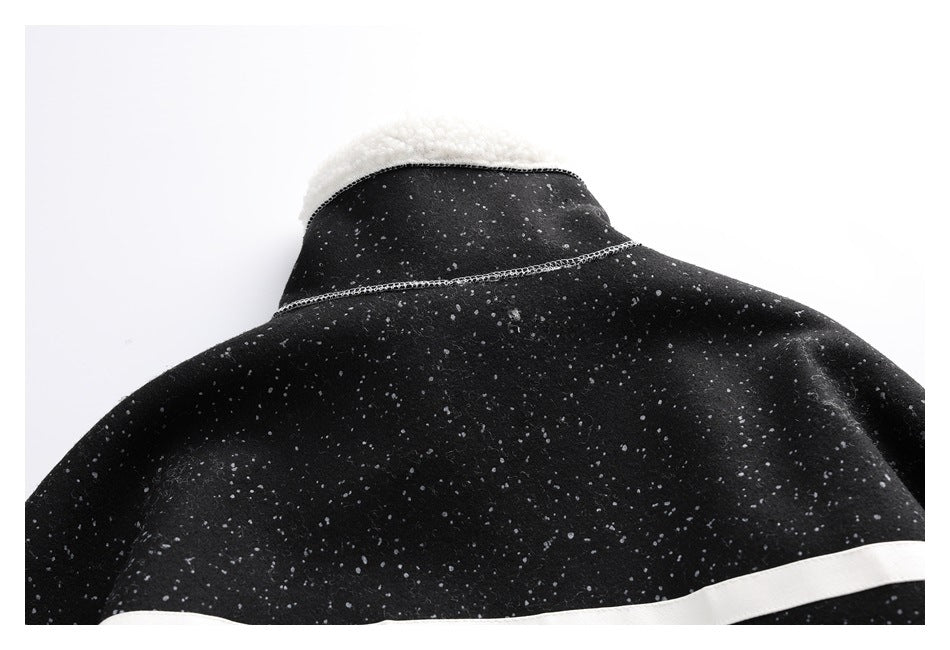 Close-up of the jacket's black speckled back collar with white fleece lining.