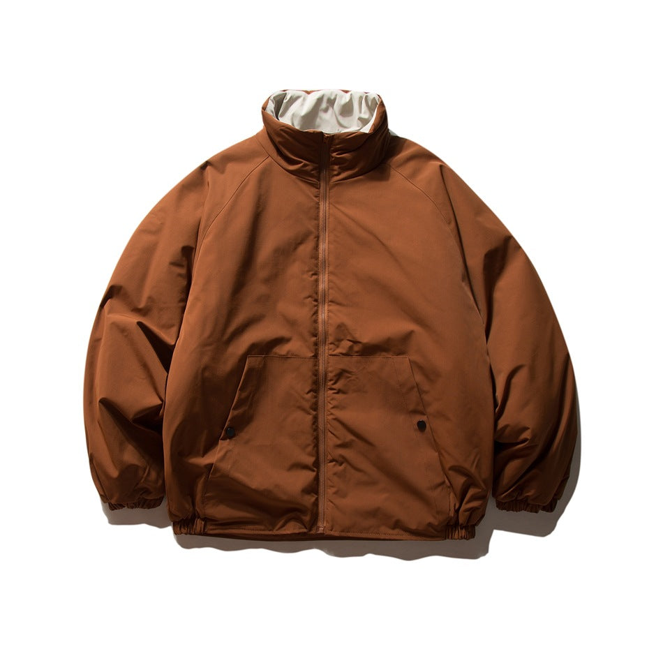 Front view of a rust-brown jacket with a high collar, full-length zipper, and two lower pockets.