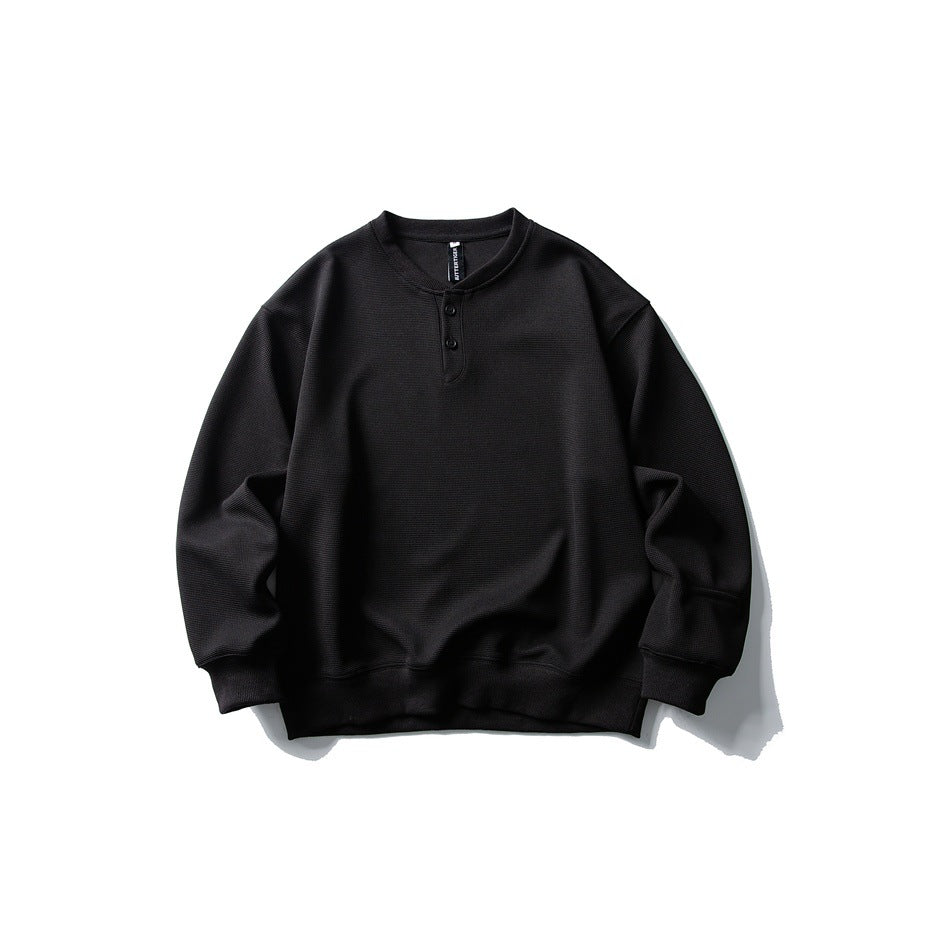 Black waffle-textured Henley pullover sweatshirt with two buttons, ribbed cuffs and hem, flat front view