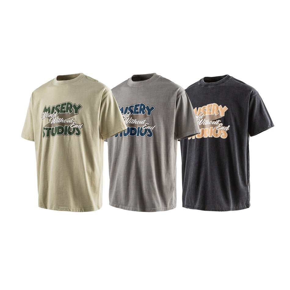 Three short-sleeve crew-neck T-shirts in beige, gray, and black, each with a large multicolor chest graphic.