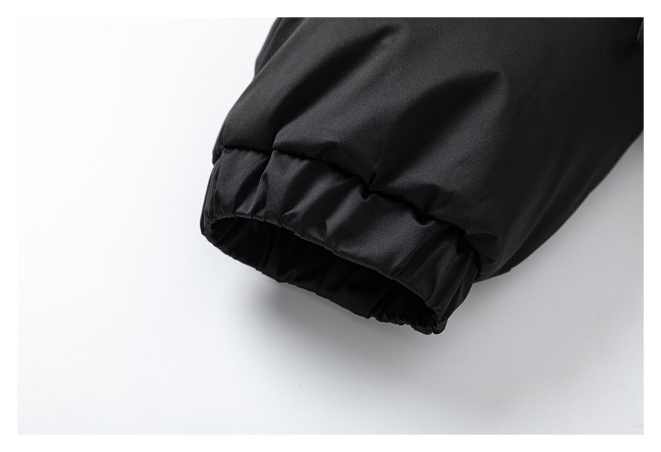 Close-up of a black garment sleeve ending in a gathered elastic cuff.