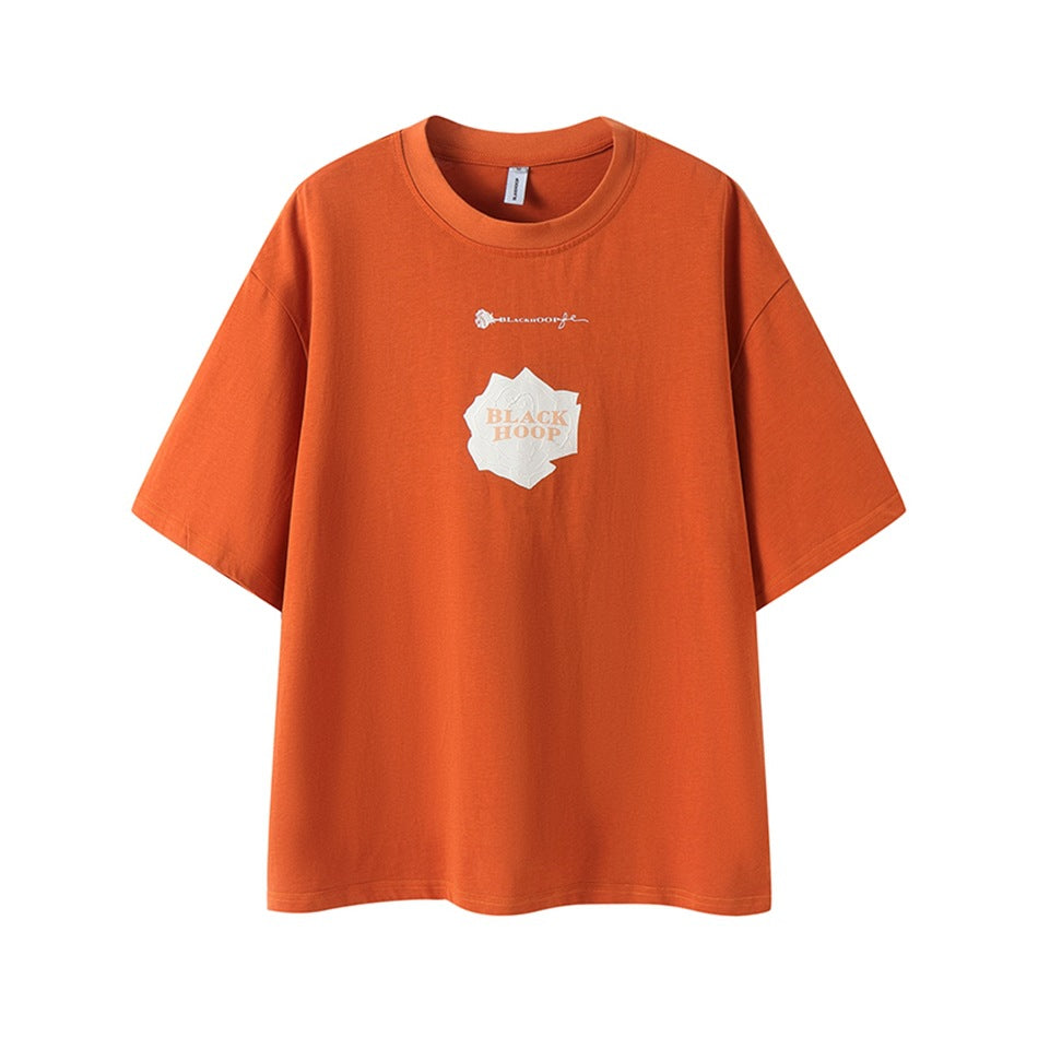 Orange short-sleeve crew-neck t-shirt with cream rose graphic and BLACK HOOP lettering on the front