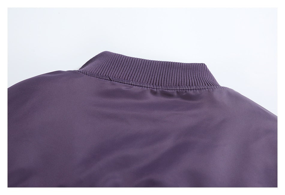 Close-up of the dark purple jacket's rib-knit collar and upper back.