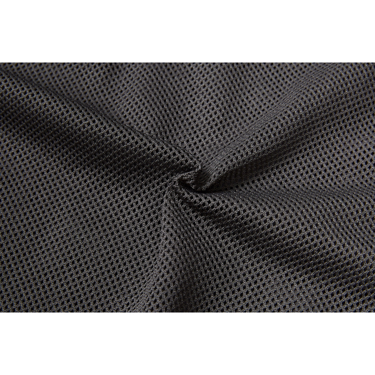 Close-up of dark mesh fabric gathered into a fold.