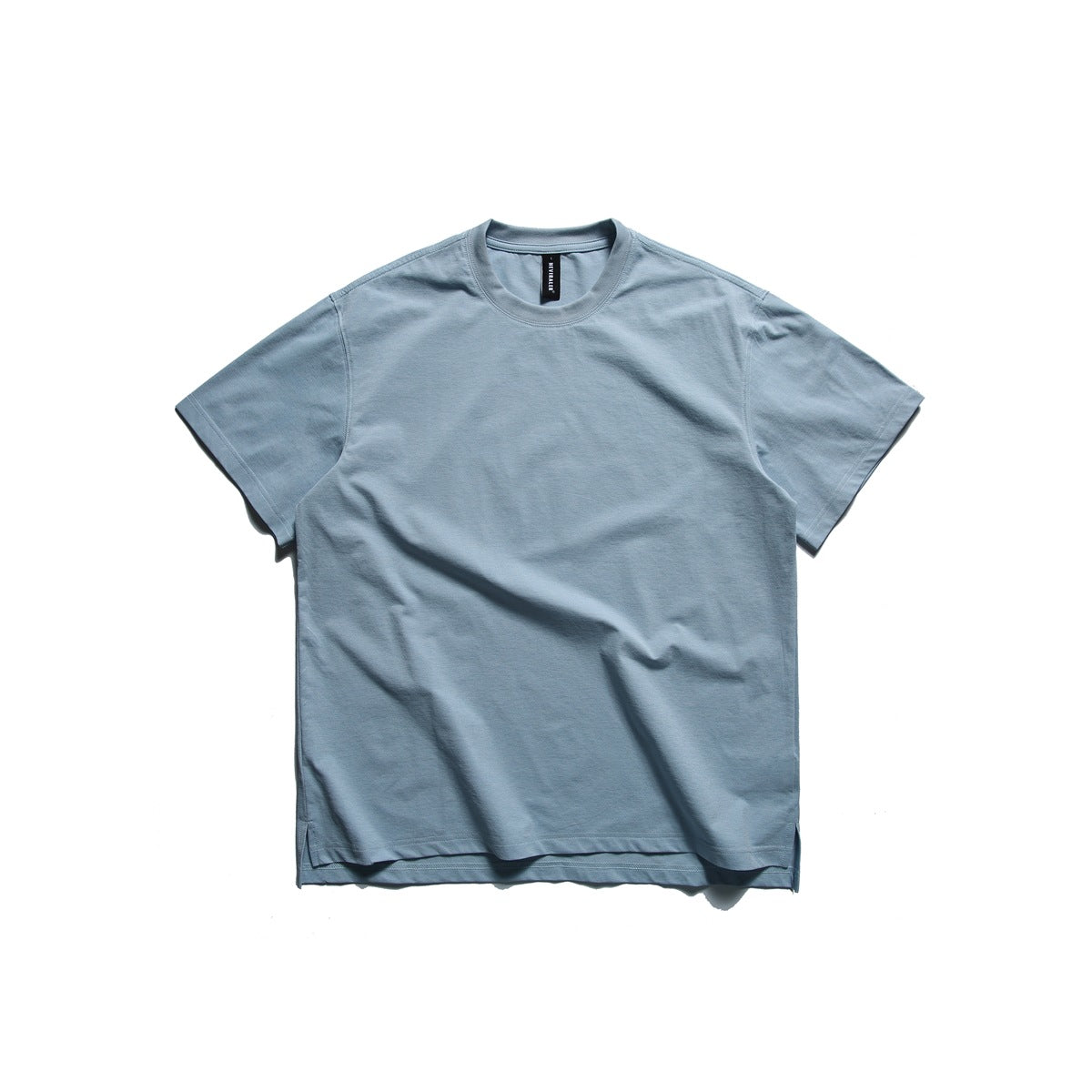 Lake blue short-sleeve crew neck T-shirt laid flat, front view, with side hem slits