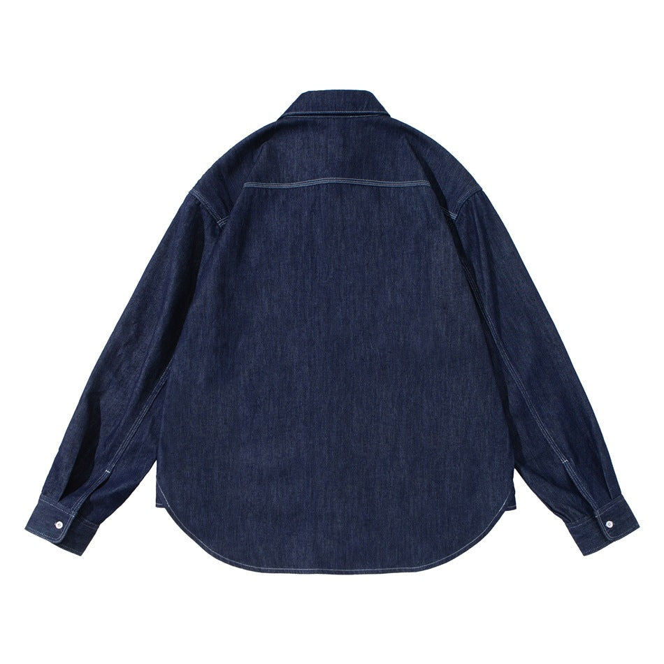 Back view of dark indigo denim shirt showing back yoke seam, long sleeves, button cuffs and curved hem