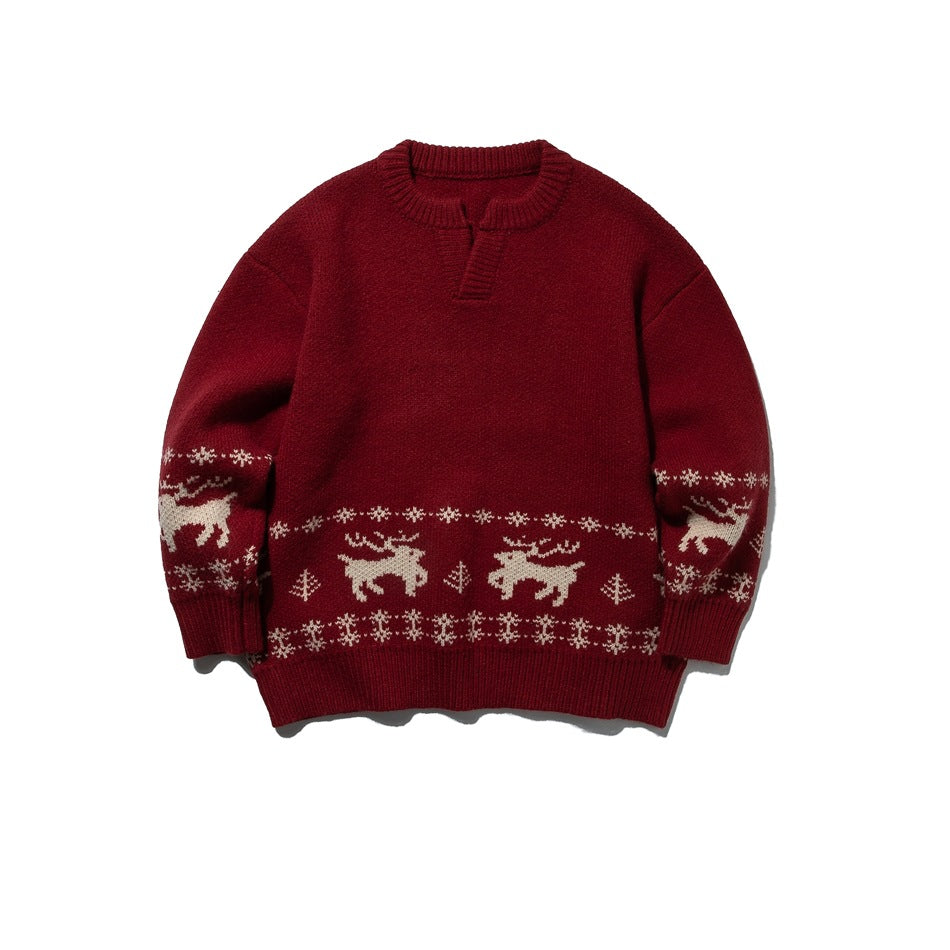 Red knit sweater with cream reindeer and snowflake jacquard band, ribbed notched neckline, front view