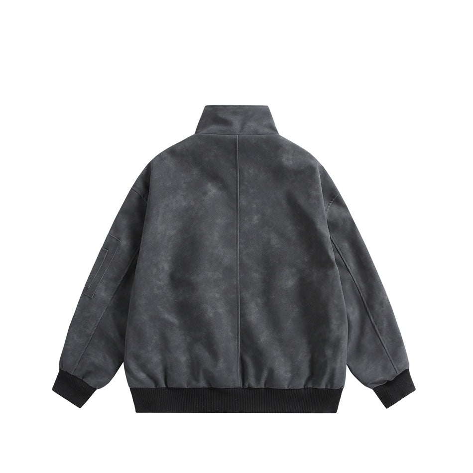 Back view of a charcoal jacket with a stand collar, center seam and black ribbed cuffs and hem.
