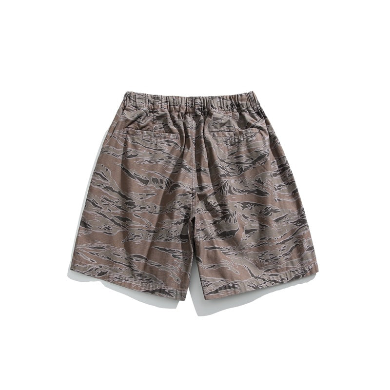 Rear view of brown-gray camouflage shorts with an elastic waistband and two back pockets, displayed flat on white.