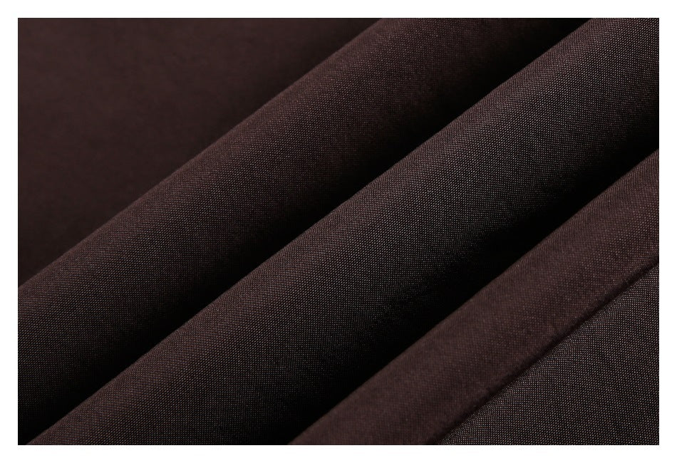 Close-up showing the fine texture and folds of dark brown jacket fabric.