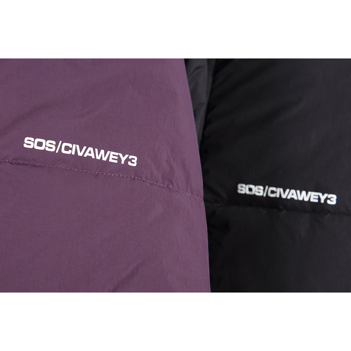 Close-up of plum and black padded jacket fabric with white lettering on each.