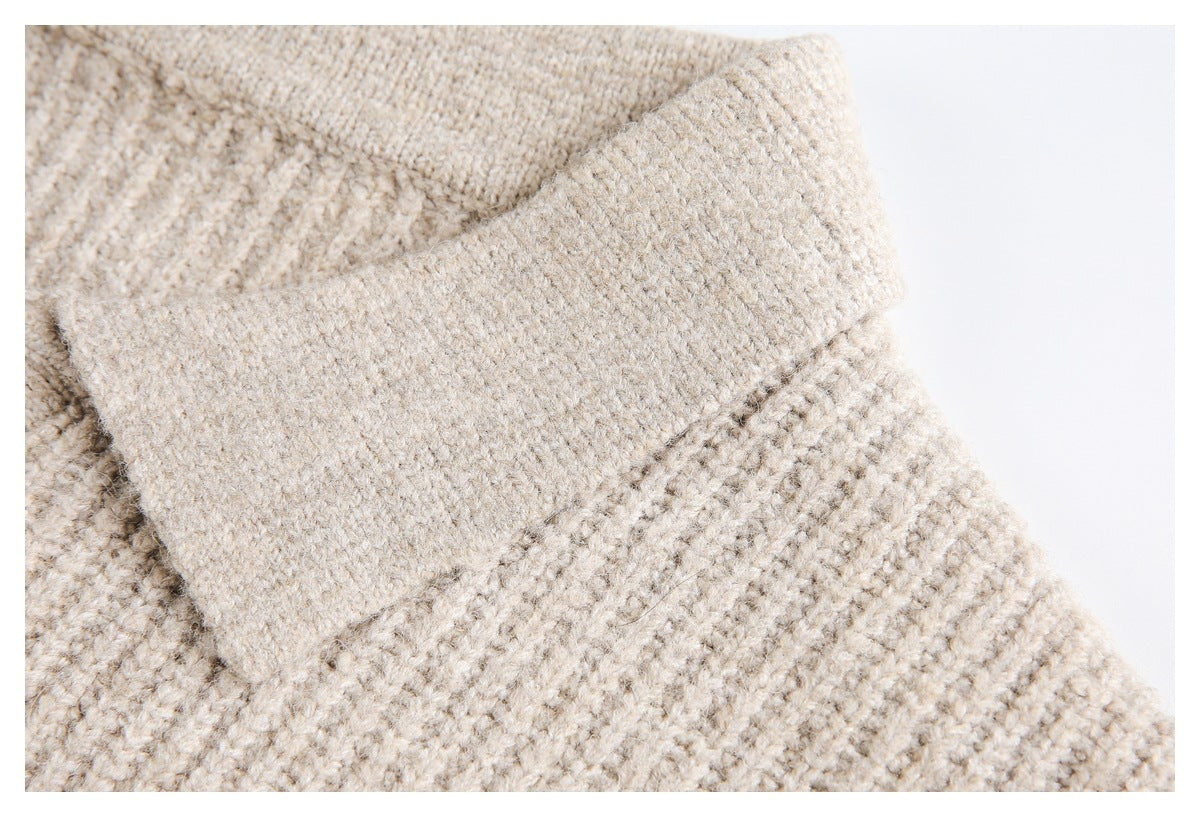 Close-up of the wide collar and textured knit on a beige top.