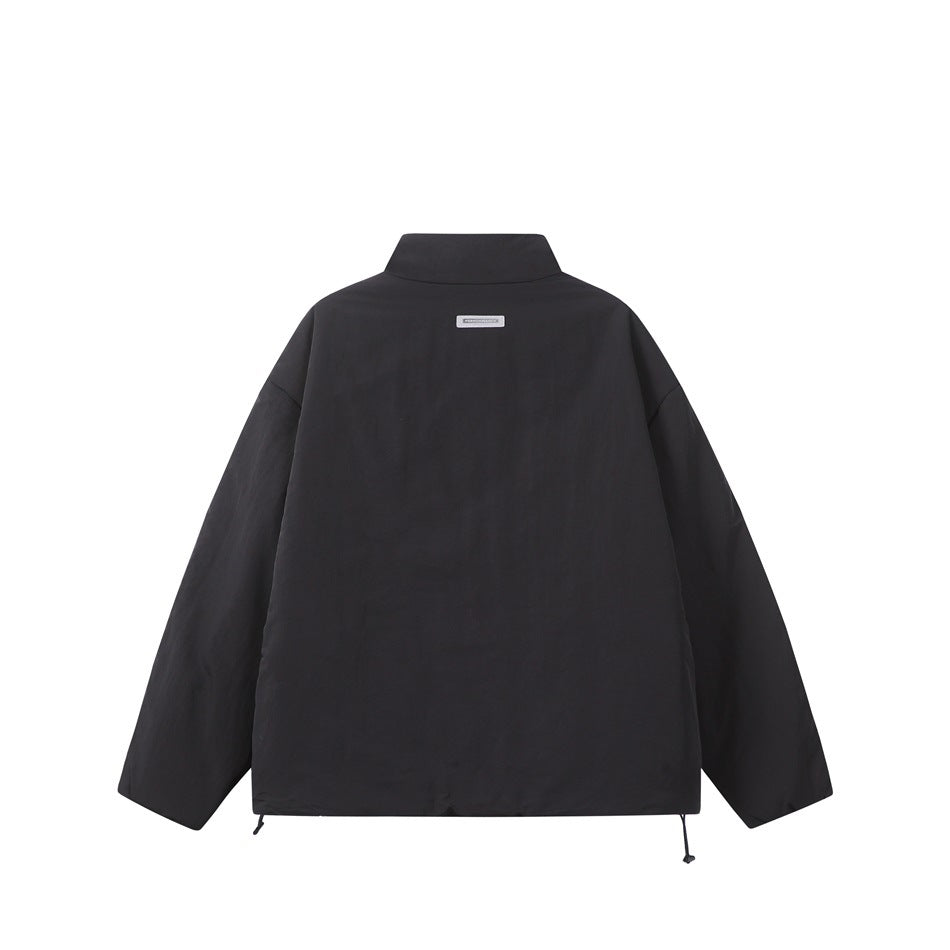 Back view of a black jacket with a raised collar, dropped shoulders, long sleeves, and adjustable hem cords.
