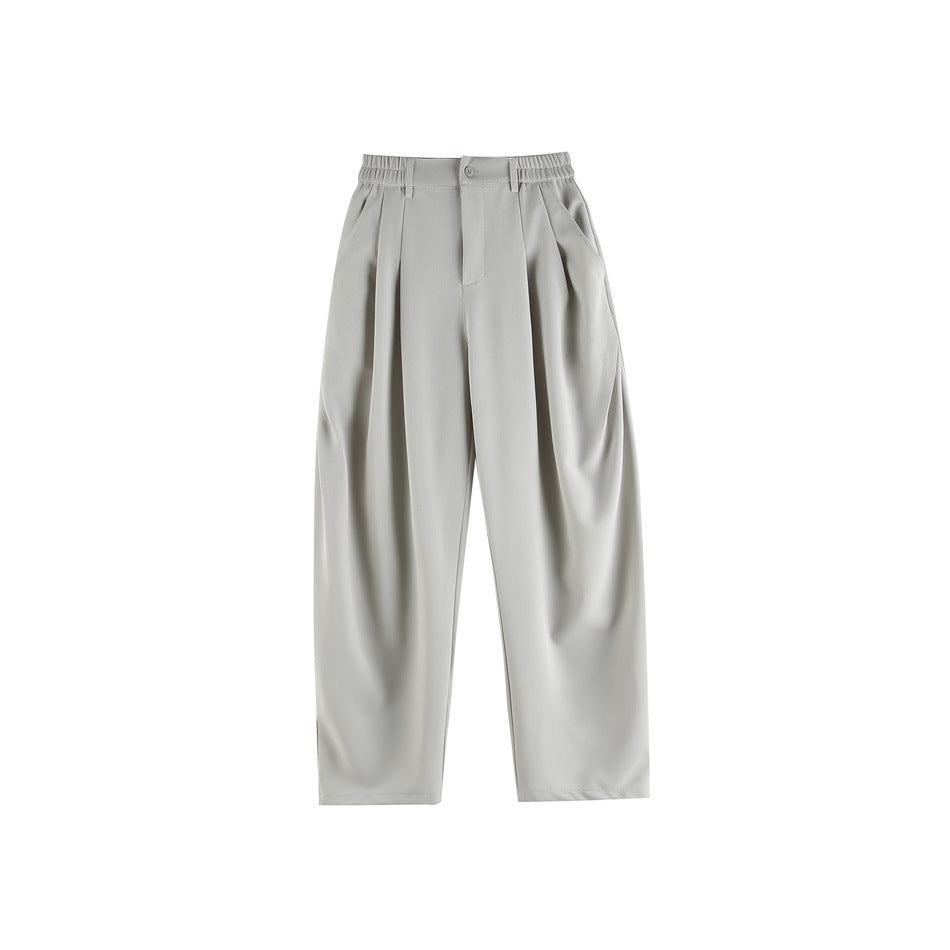 Light gray pleated wide-leg trousers with elastic waistband, button front and side pockets, flat lay front view