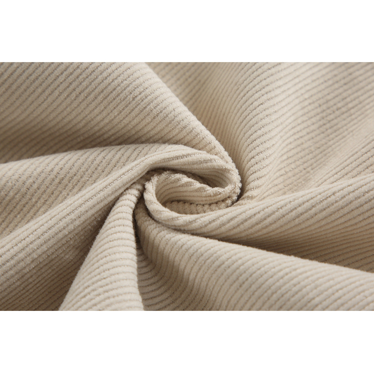 Close-up showing the fine ribbed texture of light beige jacket fabric.