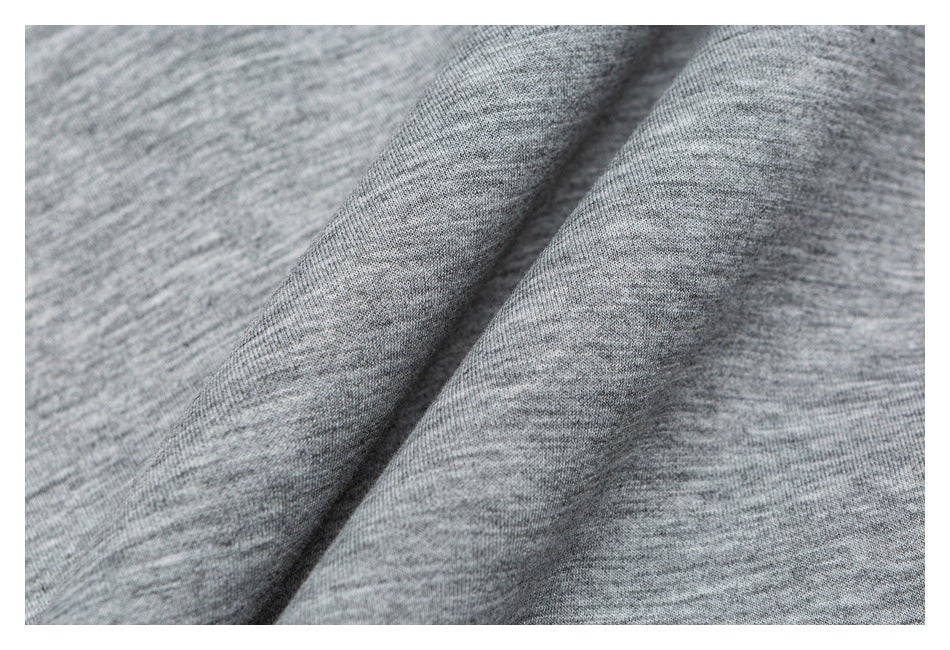 Close-up of the heather gray fabric texture draped into soft folds.