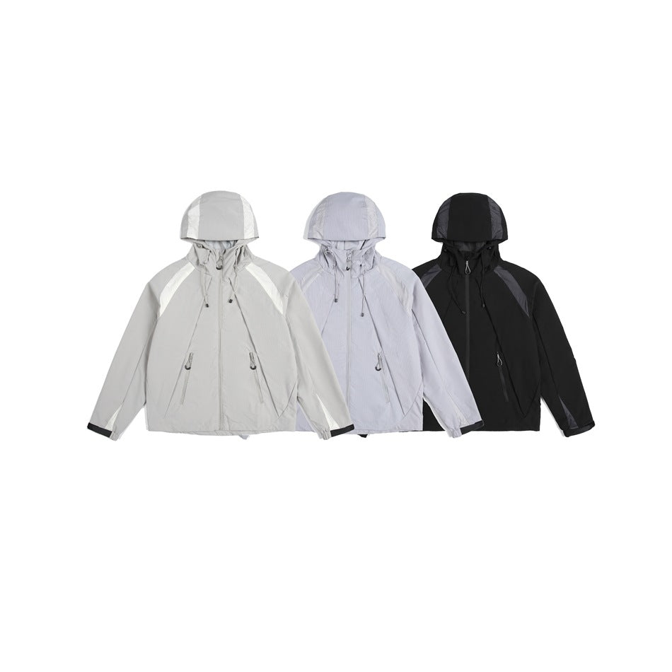 Three hooded jackets displayed together in light gray, pale lavender, and black.