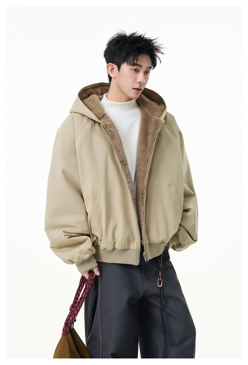 Model in a beige hooded jacket with the taupe plush lining visible along the open front.