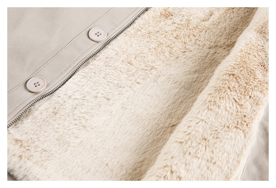 Close-up of the plush cream lining inside a beige garment, beside its zipper and buttons.