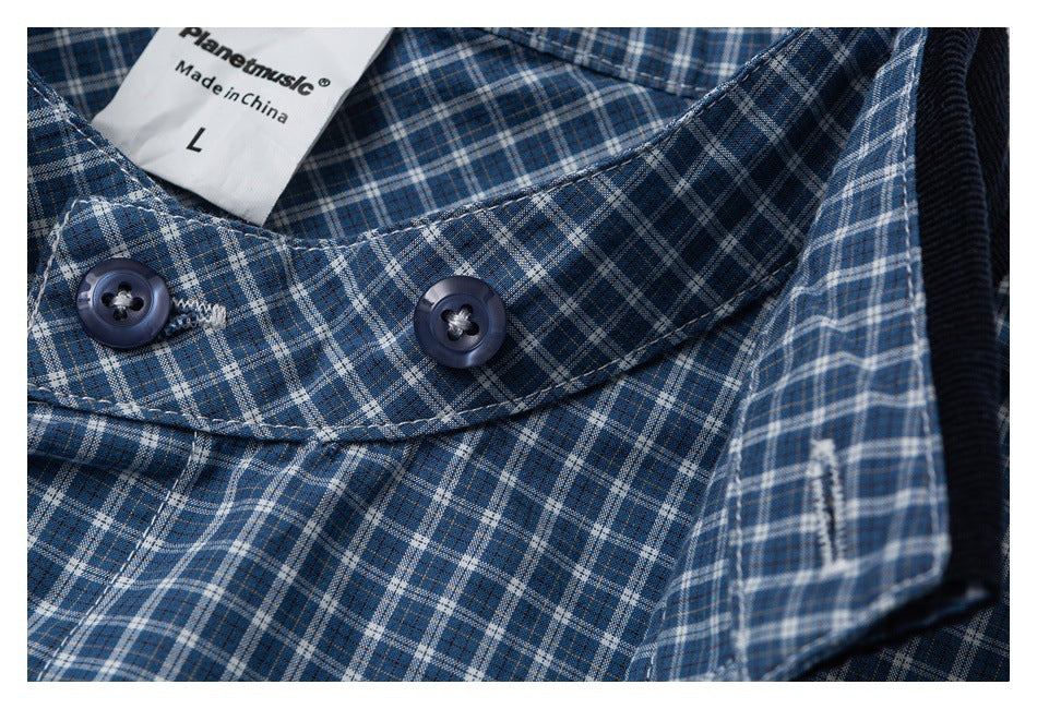 Close-up of a blue plaid shirt collar and dark buttons; the label shows size L and “Made in China.”