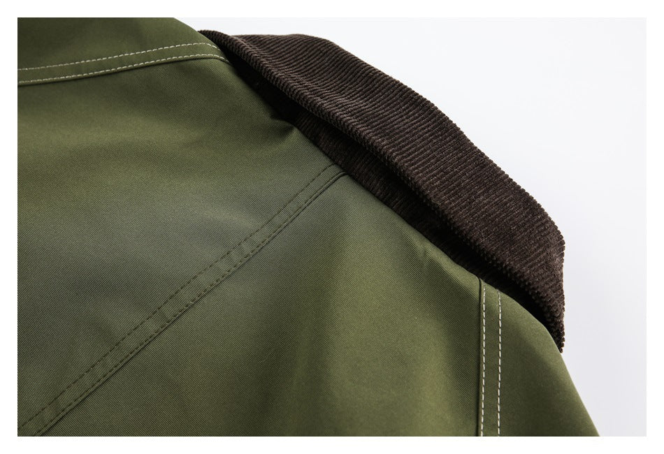Close-up of an olive-green garment with a dark brown ribbed collar and contrasting topstitching.