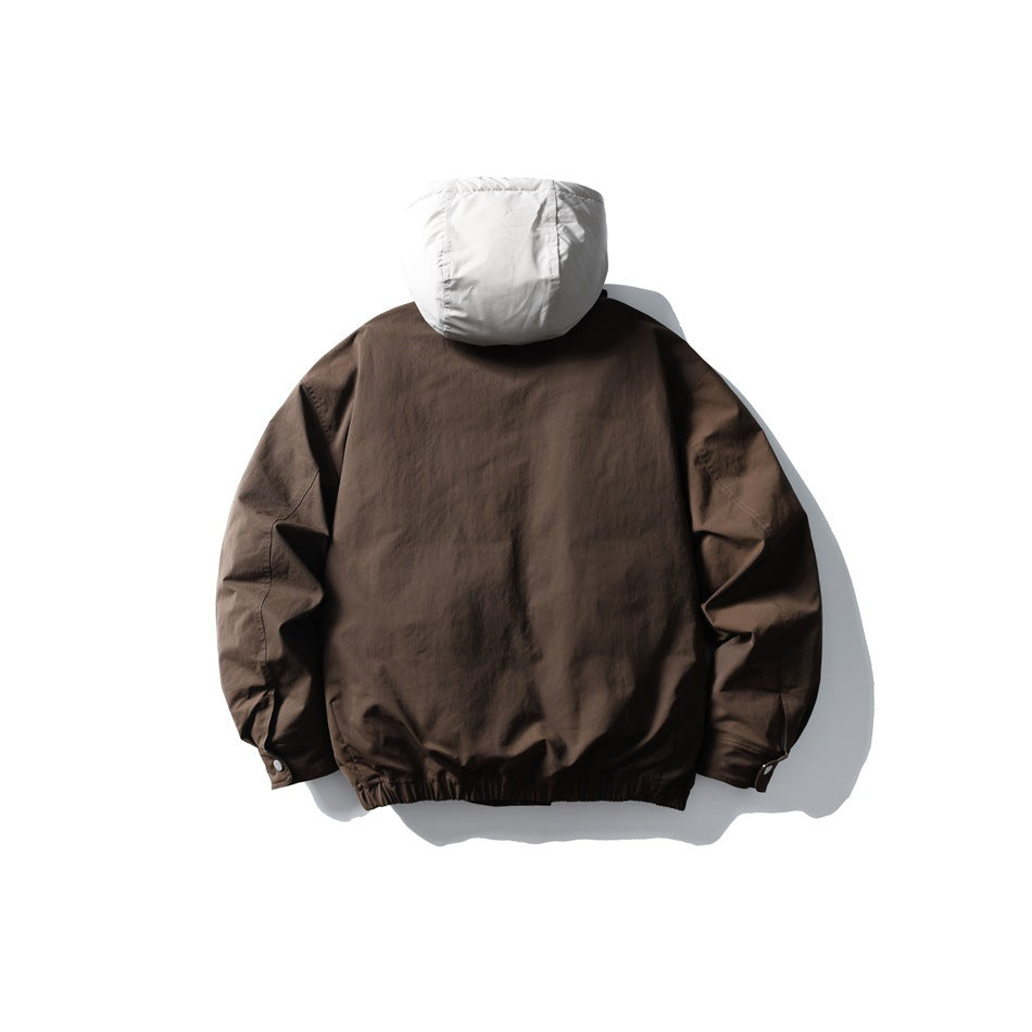 Back view of a dark brown jacket with a light gray hood, gathered hem, and buttoned cuffs.