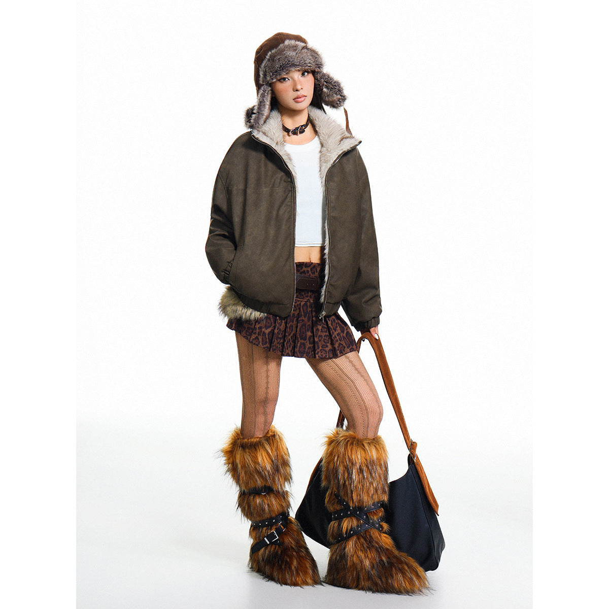 Model wearing a dark brown jacket with a light fur collar and a fur-lined trapper hat.