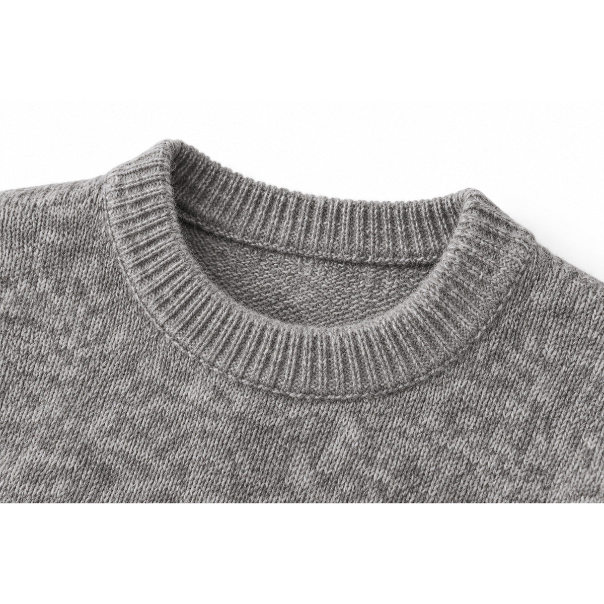 Close-up of a gray knit sweater's ribbed crew neckline and textured stitches.
