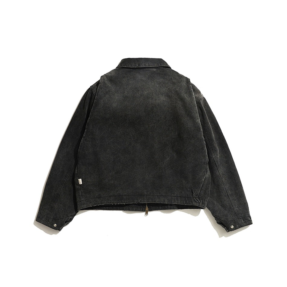 Back view of a charcoal jacket laid flat on a white background, with a collar, long sleeves, and snap cuffs.