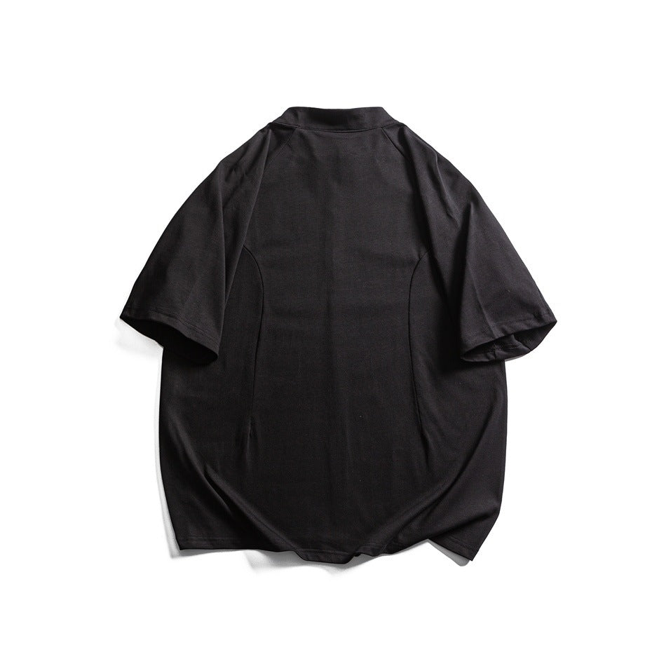 Back view of a black short-sleeve top with a stand collar and curved hem, laid flat.