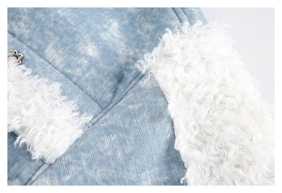 Close-up of the jacket's blue mottled fabric and thick white curly fleece cuff trim.