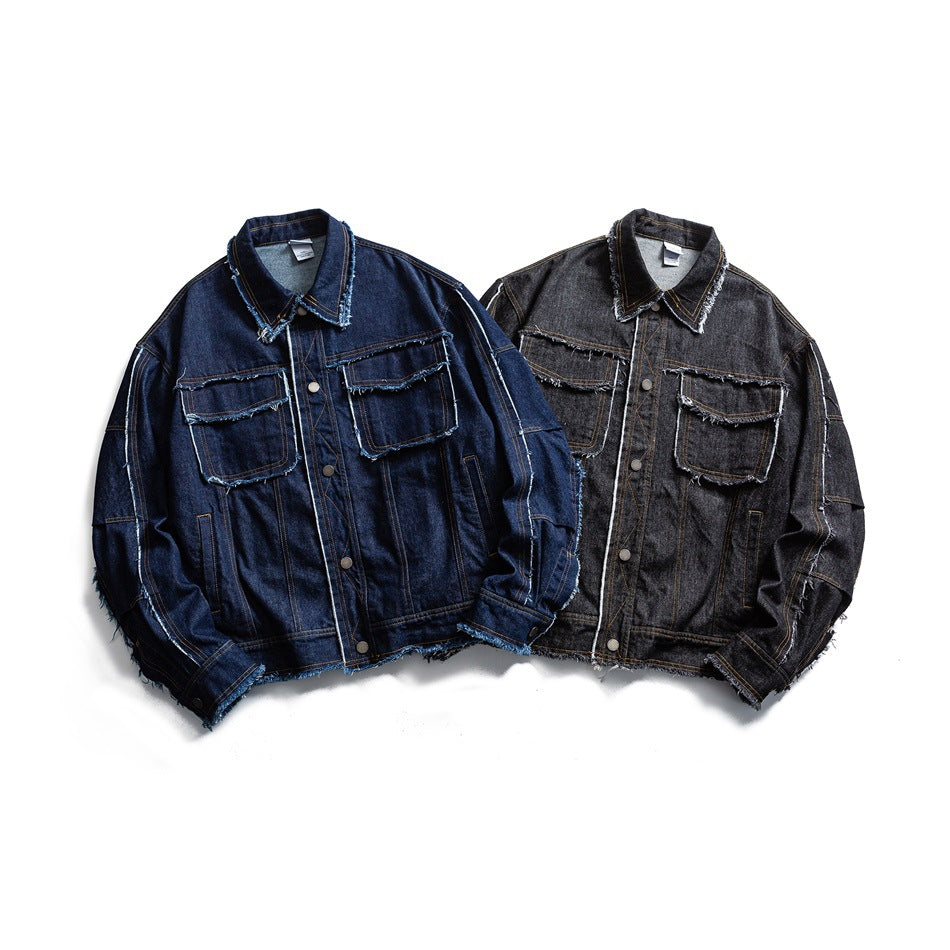 Two flat-lay denim jackets, one dark indigo and one charcoal black, with chest pockets and frayed edges.