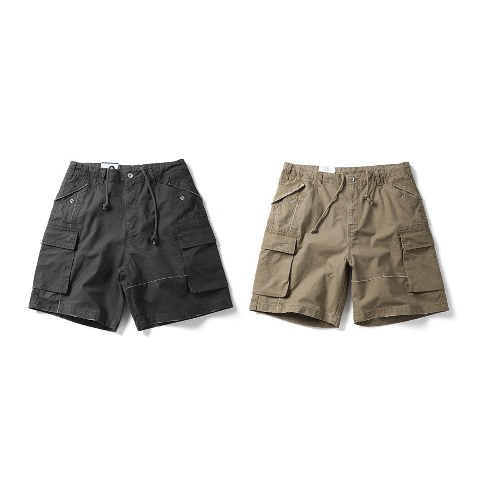 Front views of cargo shorts in black and taupe, each with a drawstring waist and large side pockets.