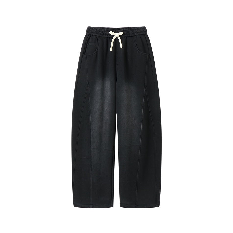 Black faded-wash wide-leg pants with elastic drawstring waistband, front view on a plain white background